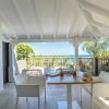 terrasse couverte avec vue sur la mer depuis les bungalows de l hotel La Toubana a Ste Anne Guadeloupe