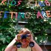 un enfant souriant au mini club du Surf Club Keros
