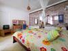 Chambre avec lit double au Pik Pik au Morne sur l'île Maurice