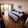 Interieur chambre avec vue jardin Piscine de hotel California sur le spot kitesurf et windsurf de El Yaque au Venezuela