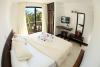 Interieur des chambres avec vue jardin de l'hotel Surf Paradise sur le spot de kitesurf et de windsurf El Yaque au Venezuela