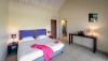 Chambre avec lits jumeaux à l'hôtel La Plénitude, à Saint Martin, sur les spots de Galion Beach et Orient Bay