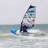 Windsurfeur en pleine action sur le spot de Dakhla Lassarga à ION Club avec du matériel Duotone